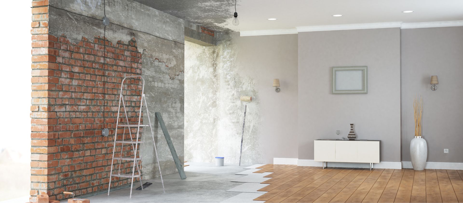 Halb fertiger Raum mit freigelegter roter Backsteinwand links und modernem, grauen Innenraum mit Parkettboden rechts.